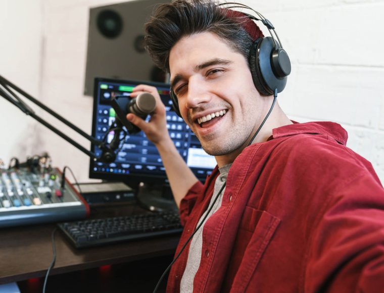 image-of-young-happy-dj-man-wearing-headphones-wor-2021-08-30-02-26-03-utc.jpg